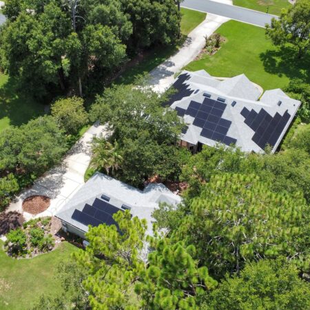 aerial view of black solar panels on top of a home and on top of an un-attached addition in Orlando, Florida