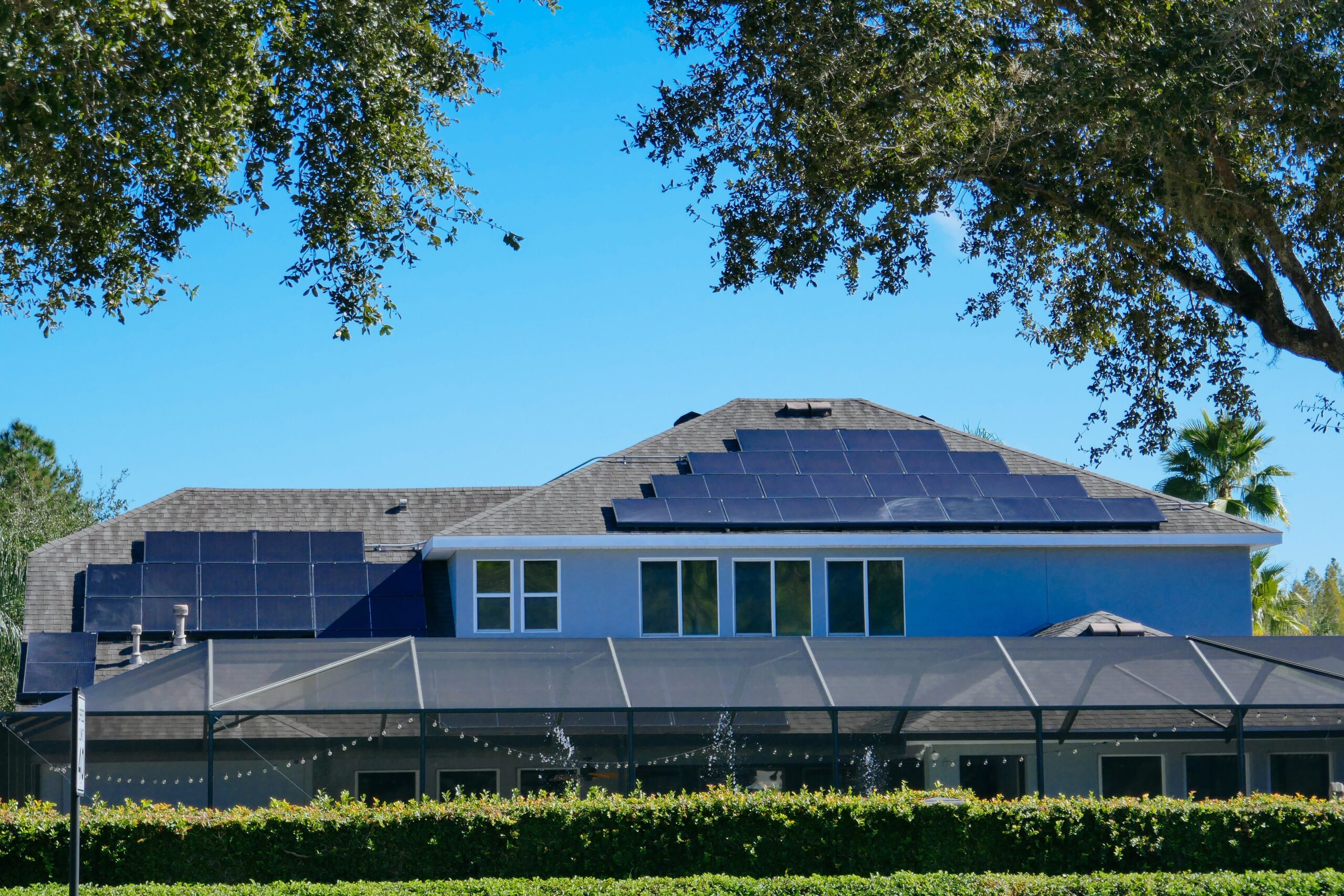 solar panels on the roof of a blue house in Orlando, Florida