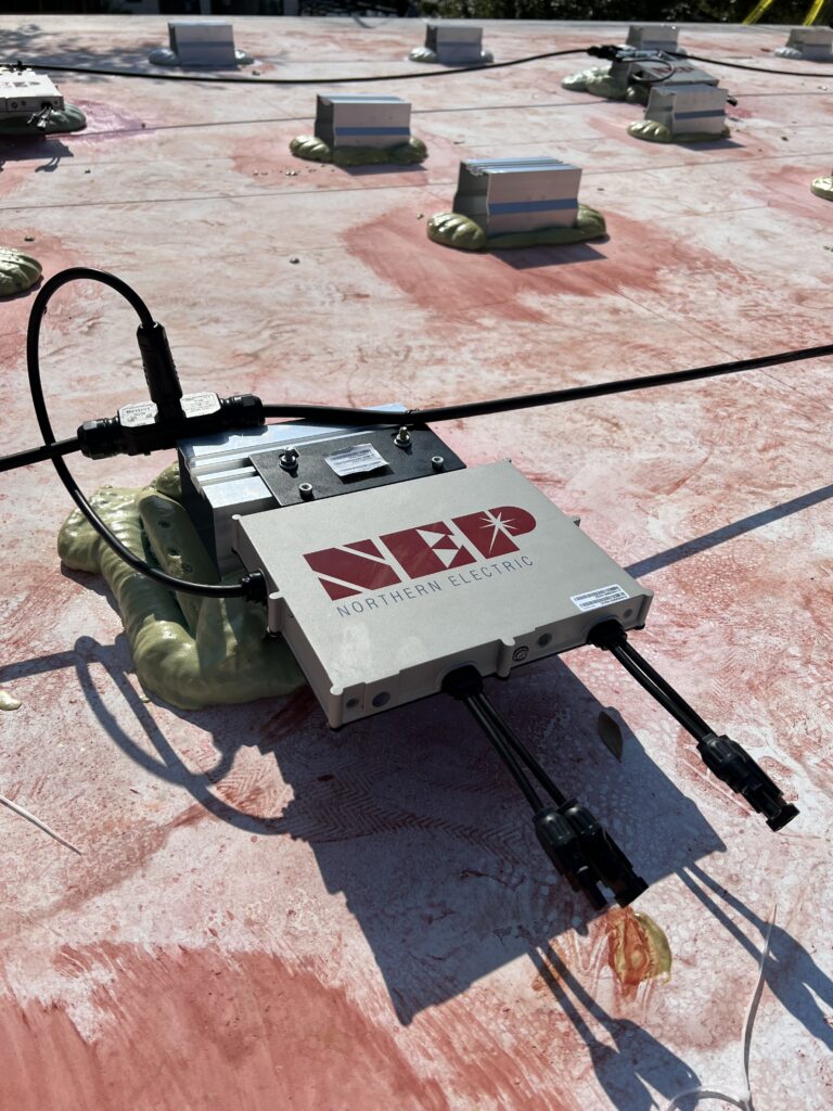 Solar inverter installed on a cement rooftop using Solar Stack product in Sanford, Florida