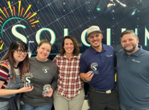 Solcium Employees holding awards at the Solcium award ceremony in Sanford, Florida