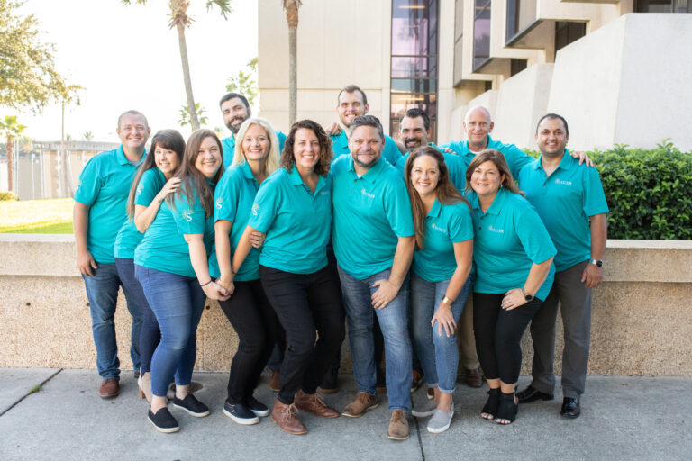 Solcium Solar leaders posing together outside in Sanford, Florida